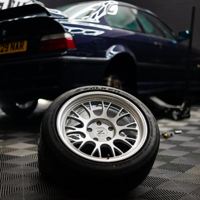 Zento MS2 x BMW E36 Installed in garage workshop, giving a motorsport ready appearance, with wheel being fitted