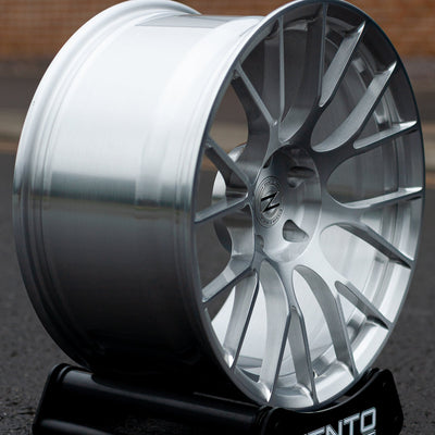 Zento MS3 Monoblock Forged Aluminium Wheel finished in brushed silver, mounted on alloy wheel stand, in English Carpark