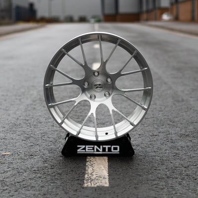 Zento MS3 Monoblock Forged Aluminium Wheel finished in brushed silver, mounted on alloy wheel stand, in English Carpark
