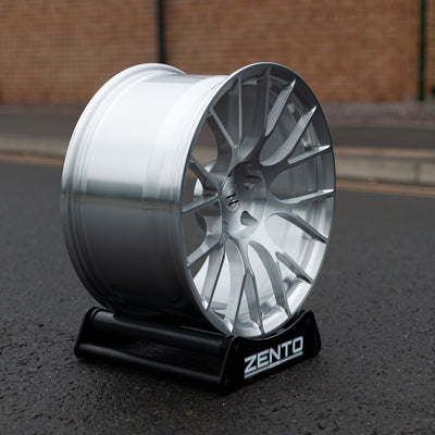 Zento MS3 Monoblock Forged Aluminium Wheel finished in brushed silver, mounted on alloy wheel stand, in English Carpark