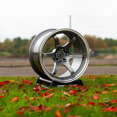 Zento MS4 Monoblock forged aluminium drift and motorsport wheel, shown with concave and dual colour on alloy wheel stand outside